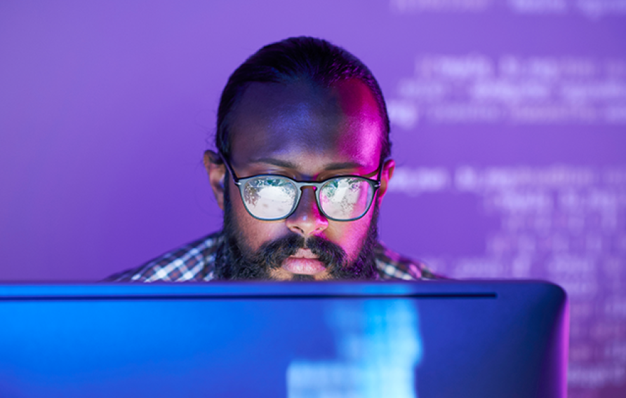 A man looking a a computer screen